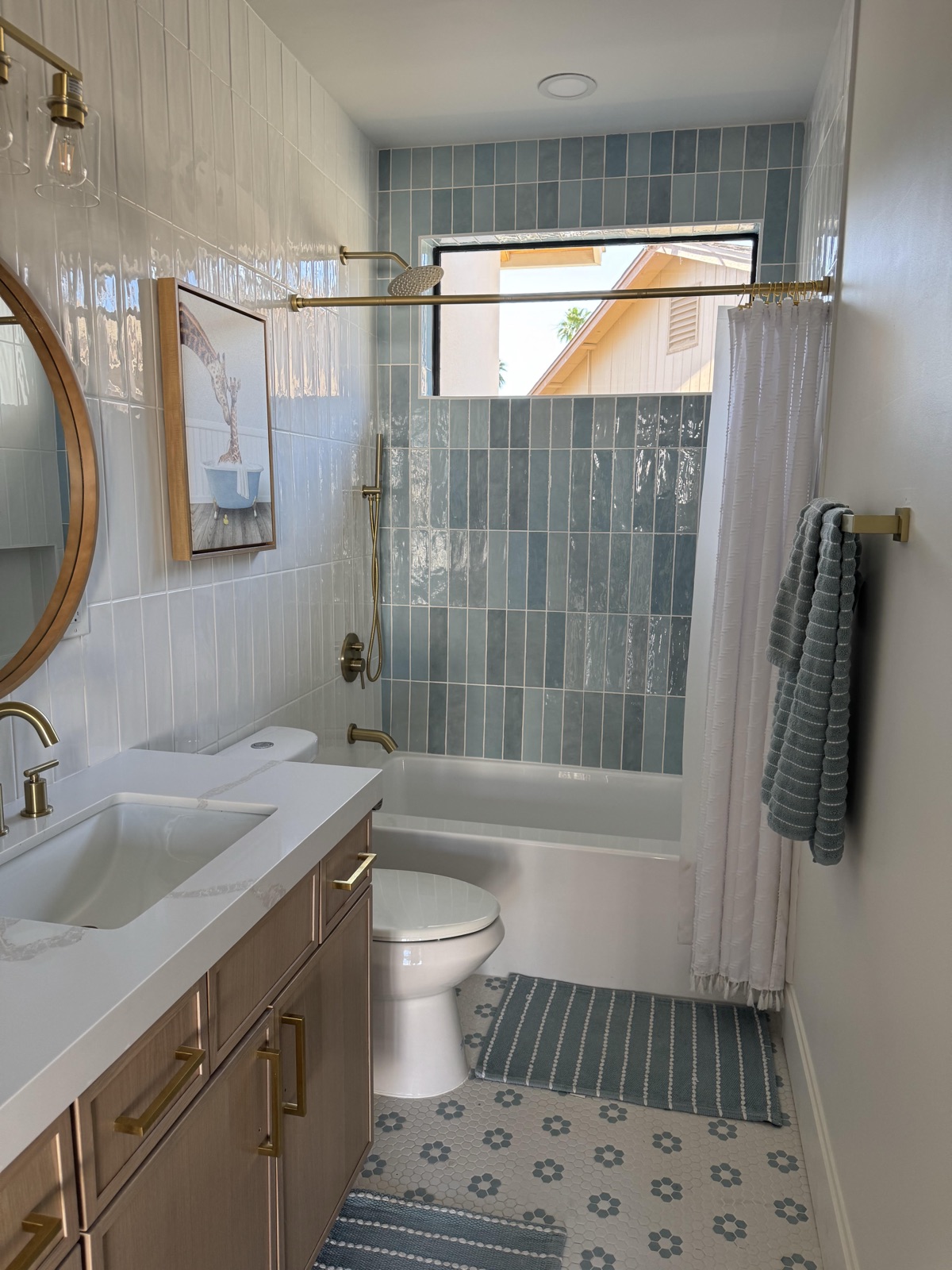 Colorful guest bathroom remodel with bold tile, floating vanity, and playful finishes in Queen Creek AZ
